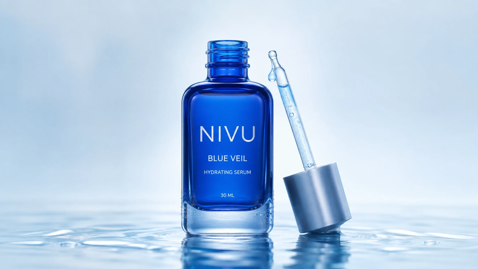NIVU Blue Veil serum in cobalt glass with a silver dropper, surrounded by water.